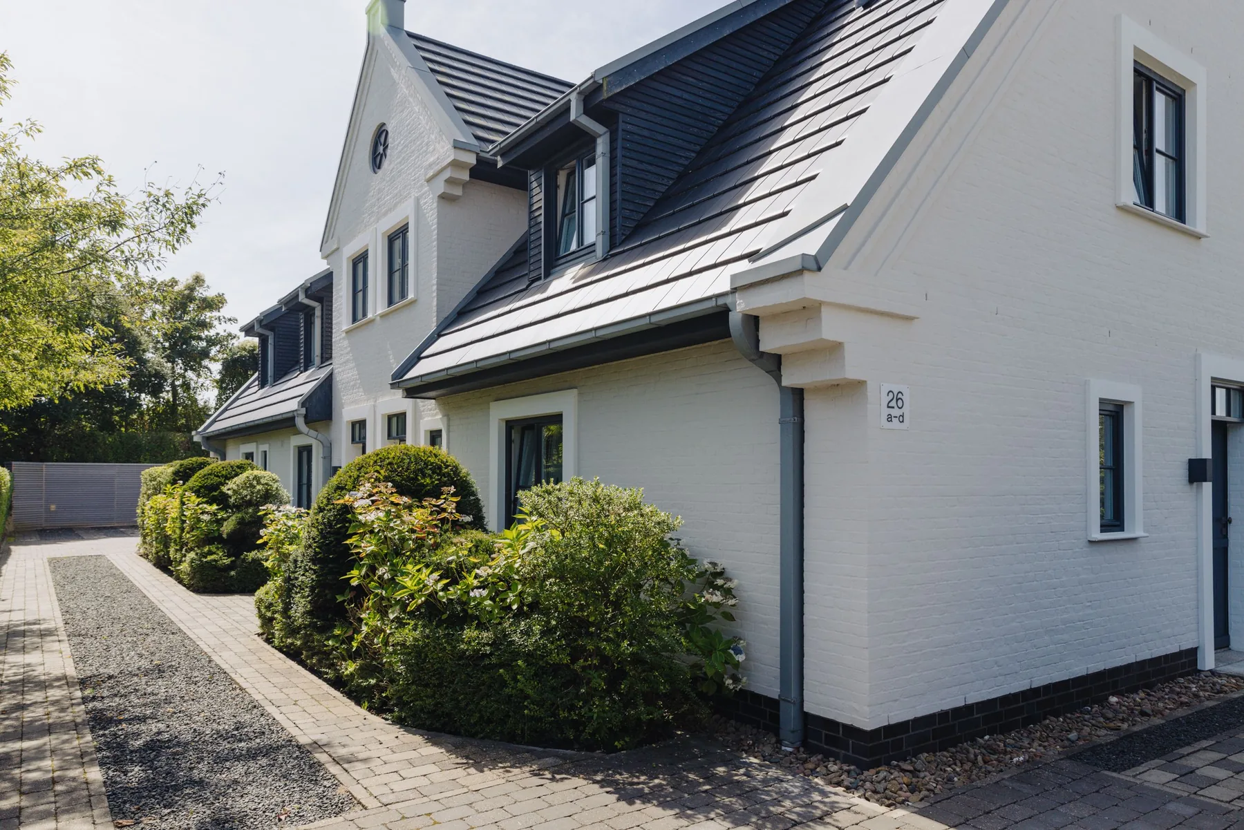 Ferienwohnung Wellenbrecher Sylt – Friesenhaus in Tinnum mit weißer Fassade